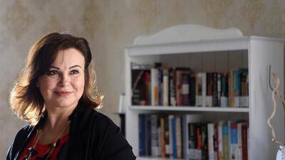 Aida Mansour, owner of Cafe Arabia, estimates there are about 1,000 books for customers to enjoy at the cafe. Satish Kumar / The National