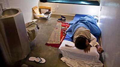 A prisoner sleeps in his cell in the camp 5 detention facility at the US Naval Base in Guantanamo Bay, Cuba.