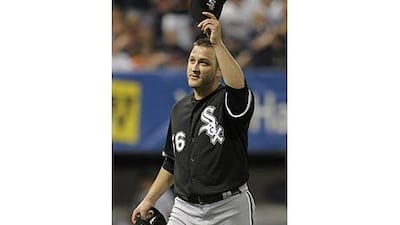 Mark Buehrle tips his hat to the crowd after his run of consecutive batters retired ended at a record 45.