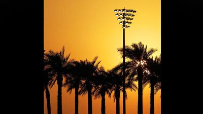 Spectators watch from a terrace of a hotel during the qualifying session at the Yas Marina racetrack, in Abu Dhabi, United Arab Emirates. Luca Bruno / AP Photo