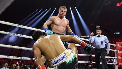 LAS VEGAS, NEVADA - MAY 04: Canelo Alvarez knocks down Jaime Munguia in their super middleweight championship title fight at T-Mobile Arena on May 04, 2024 in Las Vegas, Nevada. Christian Petersen / Getty Images / AFP (Photo by Christian Petersen / GETTY IMAGES NORTH AMERICA / Getty Images via AFP)