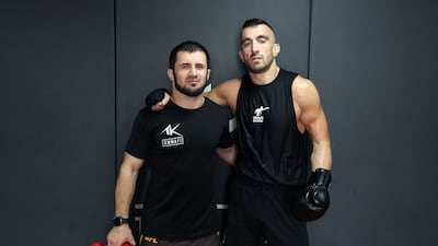 Mohammad Yahya alongside his head coach, Azamat Gashimov. T