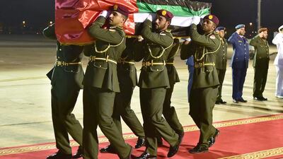 The bodies of the four Emirati serviceman killed in Yemen are carried off the military plane on Wednesday.