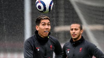Roberto Firmino heads the ball in Liverpool training. Getty