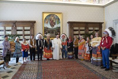 Indigenous delegates from Canada's First Nations pose for a photo with Pope Francis during a meeting at the Vatican, on March 31, 2022. Vatican via Reuters