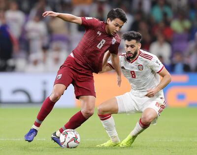 UAE midfielder Majed Hassan, right, has started only one match this tournament, against Thailand. Chris Whiteoak / The National
