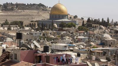 The Dome of the Rock, in the old city of Jerusalem, and the ancient Jewish cemetery on Mount of Olives in the background. Unesco passed a resolution that denies the Jewish link to the Temple Mount and the Western Wall. Atef Safadi / EPA
