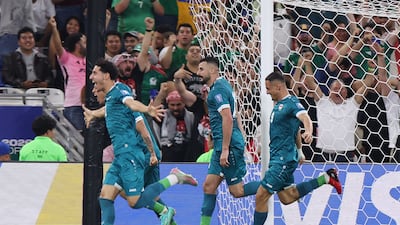 Aymen Hussein, centre, scored what proved to be the winner and the goal that sent Iraq to a first World Cup since 1986. AFP