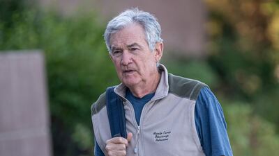 Federal Reserve Chairman Jerome Powell walks the grounds at the Jackson Hole symposium venue in Wyoming. Bloomberg