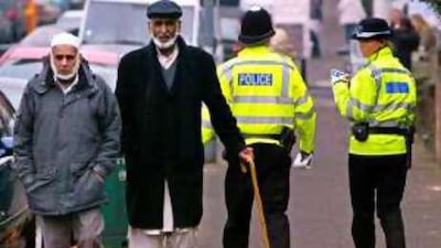 A policeman and a police community support officer hand out leaflets in Birmingham in 2008 after five men were arrested over a plot to kidnap and behead a British soldier.