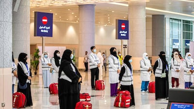 Health ministry employees wait to receive Hajj pilgrims at Jeddah's King Abdulaziz International Airport. Saudi Ministry of Hajj and Umra / AFP