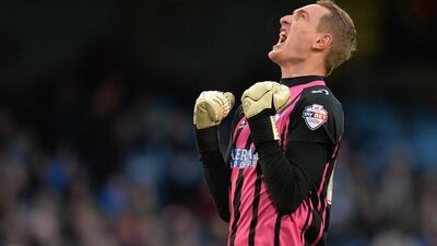 Sheffield Wednesday's goalkeeper Chris Kirkland celebrates after his side's opening goal to lead 1-0 in an eventual 2-1 loss to Manchester City in the FA Cup third round on Sunday. Peter Powell / EPA