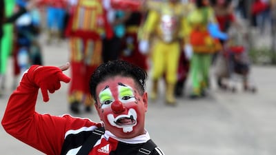 A clown gestures during the celebrations. AFP