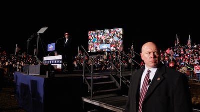 A Secret Service agent keeps watch as former US president Donald Trump speaks during a rally in South Carolina on March 12. Reuters
