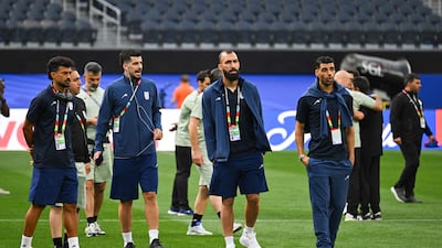 From left: Iran defender Ramin Rezaeian, midfielder Saeid Ezatolahi, midfielder Roozbeh Cheshmi and forward Mehdi Taremi walk around the pitch after the press conference at Los Angeles Stadium in Inglewood. AFP