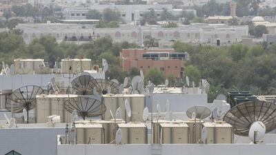 Illegal satellite dishes are prevalent on the rooftops of buildings in Abu Dhabi. Mona Al Marzooqi / The National