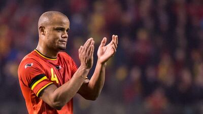 Vincent Kompany and Belgium drew Ivory Coast 2-2. They'll play in Group H at the 2014 World Cup with Algeria, Russia and South Korea. Geer Vanden Wijngaert / AP
