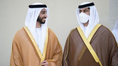 Sheikh Zayed bin Mansour bin Zayed (L) speaks with Sheikh Hazza bin Hamdan bin Zayed (R) during their wedding at Qasr Al Hosn.