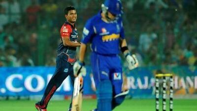 Pawan Negi, the left-arm spinner who orchestrated a collapse, took four Rajasthan wickets including the one of Brad Hodge. Sajjad Hussain / AFP