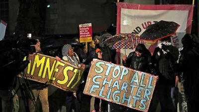 Campaigners chant slogans outside Downing Street as they protest against government plans to deport 50 people to Jamaica, in London, Monday, Feb. 10, 2020. The deportation flight is understood to be leaving the UK early Tuesday AP