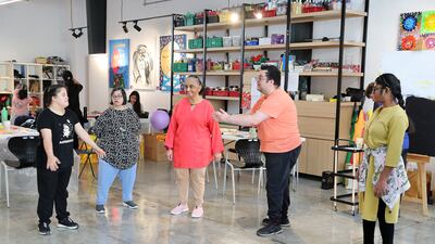 The students play games they can later use when interacting with visitors. Pawan Singh / The National