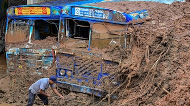 Buses partially buried by a landslide in the aftermath of Cyclone Ditwah, in Maspanna, Sri Lanka. AFP
