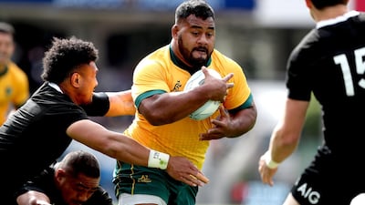 New Zealand's Ardie Savea tackles Taniela Tupou. AFP