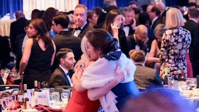 Guests embrace following a shooting incident during the annual White House Correspondents’ Association dinner in Washington, D. C. , U. S. , April 25, 2026 REUTERS / Jonathan Ernst
