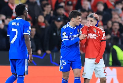 Benfica's Argentine forward Gianluca Prestianni hides his mouth while arguing with Real Madrid's Brazilian forward Vinicius Junior. AFP