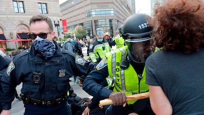 Counter protesters and police clash outside of a gathering of the far right group 'Super Fun Happy America' as they hold a protest in Copley Square in Boston, Massachusetts. AFP
