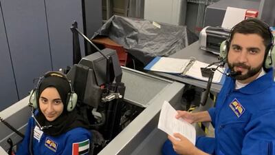 Ms Al Matrooshi and Mr Al Mulla learn how to fly through a simulator course in Florida. Photo: MBRSC