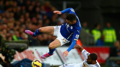 Ashley Williams of Swansea City tackles David Nugent of Leicester City during his side's 2-0 win in the Premier League on Saturday at the Liberty Stadium. Clive Rose / Getty Images