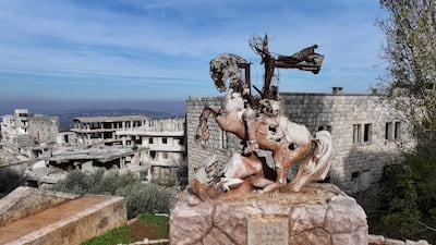 Destroyed statue of Saint George and the Dragon in Al-Ghassaniya, a mainly Christian town in central Syria, as residents who fled during the civil war begin to return. AFP