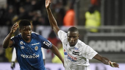 Sehrou Guirassy, right, and his Amiens teammates have been relegated from the French top-flight after the season was ended early due to the corpnavirus. AFP