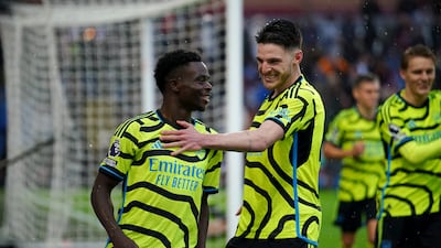 Arsenal's Bukayo Saka (left) celebrates with Declan Rice after scoring their side's third goal of the game during the Premier League match at Turf Moor, Burnley. Picture date: Saturday February 17, 2024. PA Photo. See PA story SOCCER Burnley. Photo credit should read: Peter Byrne/PA Wire. RESTRICTIONS: EDITORIAL USE ONLY No use with unauthorised audio, video, data, fixture lists, club/league logos or "live" services. Online in-match use limited to 120 images, no video emulation. No use in betting, games or single club/league/player publications.