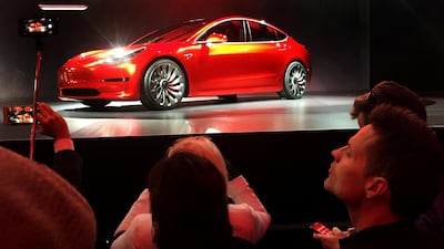 A Tesla Model 3 saloon. The firm has temporarily stopped production of the car. Joe White/Reuters