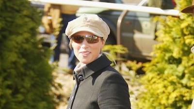 Zara Phillips, wearing a black coat and a baker boy hat, attends the Cheltenham Gold Cup on March 16, 2004. Getty Images