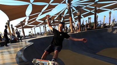 Skaters use the facilities at the DubaiX skatepark at Jumeirah Kite beach in Dubai. Satish Kumar / The National