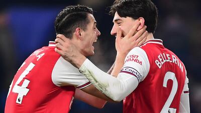 Arsenal's Granit Xhaka and Hector Bellerin celebrate getting a draw at Stamford Bridge. Getty