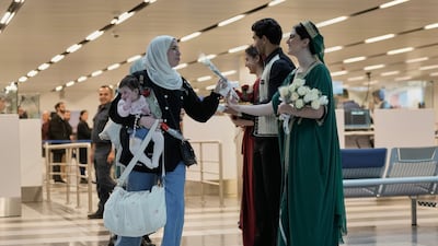 A Lebanese welcoming committee greeted passengers arriving on an Emirates flight to Beirut. AP