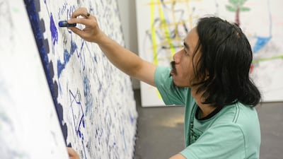 Iabodiou Piko working on a project. Khushnum Bhandari / The National