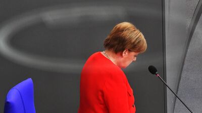 In this file photo taken on June 06, 2018 German Chancellor Angela Merkel stands in the government's bench to answer questions of delegates at the Bundestag (lower house of parliament) in Berlin. German Chancellor Angela Merkel's future hangs in the balance on July 1, 2018, as her conservative coalition allies choose between accepting a European compromise on migration or exploding her fourth government months into its term. Tobias Schwarz / AFP