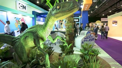 Shape of things to come: a dinosaur serves as an advertisement next to the booth of the IMG Worlds of Adventure project. Antonie Robertson / The National