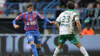 Caen's Argentinian forward Emiliano Sala (L) vies for the ball with Saint-Etienne's French defender Paul Baysse during the French L1 football match between Caen and Saint-Etienne on February 1, 2015. AFP