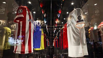 A view of Real Madrid and Atletico Madrid shirts at the Champions League Gallery in Lisbon in May 2014. Mario Cruz / EPA