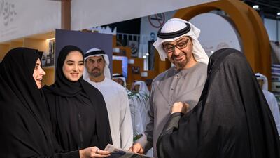 President Sheikh Mohamed in discussion with a group of exhibitors on Adihex day three. Abdulla Al Neyadi / UAE Presidential Court