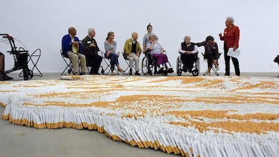 A tour group of dementia patients observe the Xu Bings installation at Lehmbruck Museum in the German town of Duisburg. Lehmbruck Museum