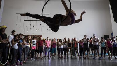 Francesca Carlson, an aerial performer, shows off her talents to the crowd.