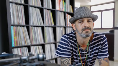 Analog Room’s Shadi Megallaa with his vinyl record collection. Victor Besa for The National
