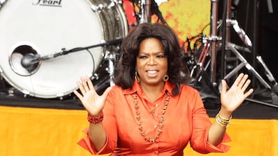 Oprah Winfrey wears a full orange dress during a taping of the 'Oprah Winfrey Show' at the Sydney Opera House on December 14, 2010 in Sydney, Australia. Getty Images
